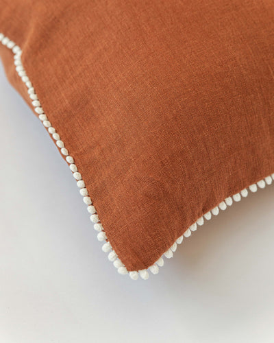 Cushion cover with pom poms in Cinnamon - sneakstylesanctums