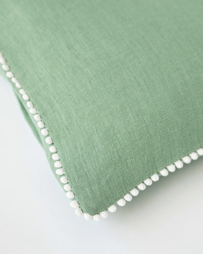 Cushion cover with pom poms in Matcha green - sneakstylesanctums
