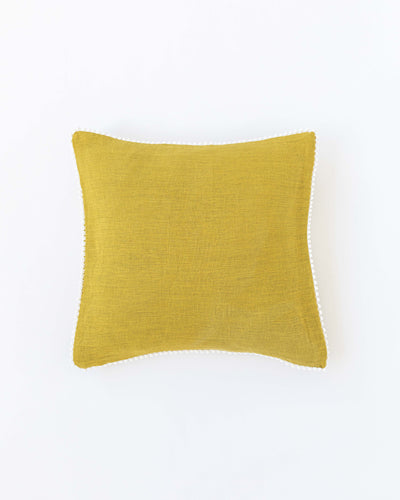 Cushion cover with pom poms in Moss yellow - sneakstylesanctums
